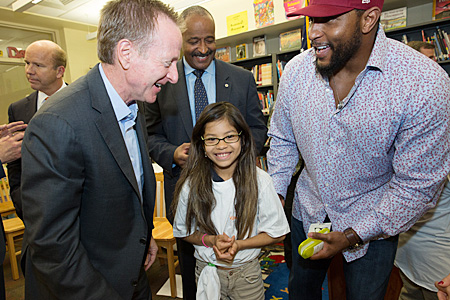 VTL CEO Austin Beutner, Michael Thomas of City Schools, and Ray Lewis with a student at Hampstead Hill Academy