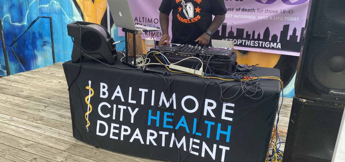 Baltimore City Health Department Logo on table spread in the community
